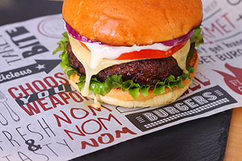 Burger on greaseproof paper